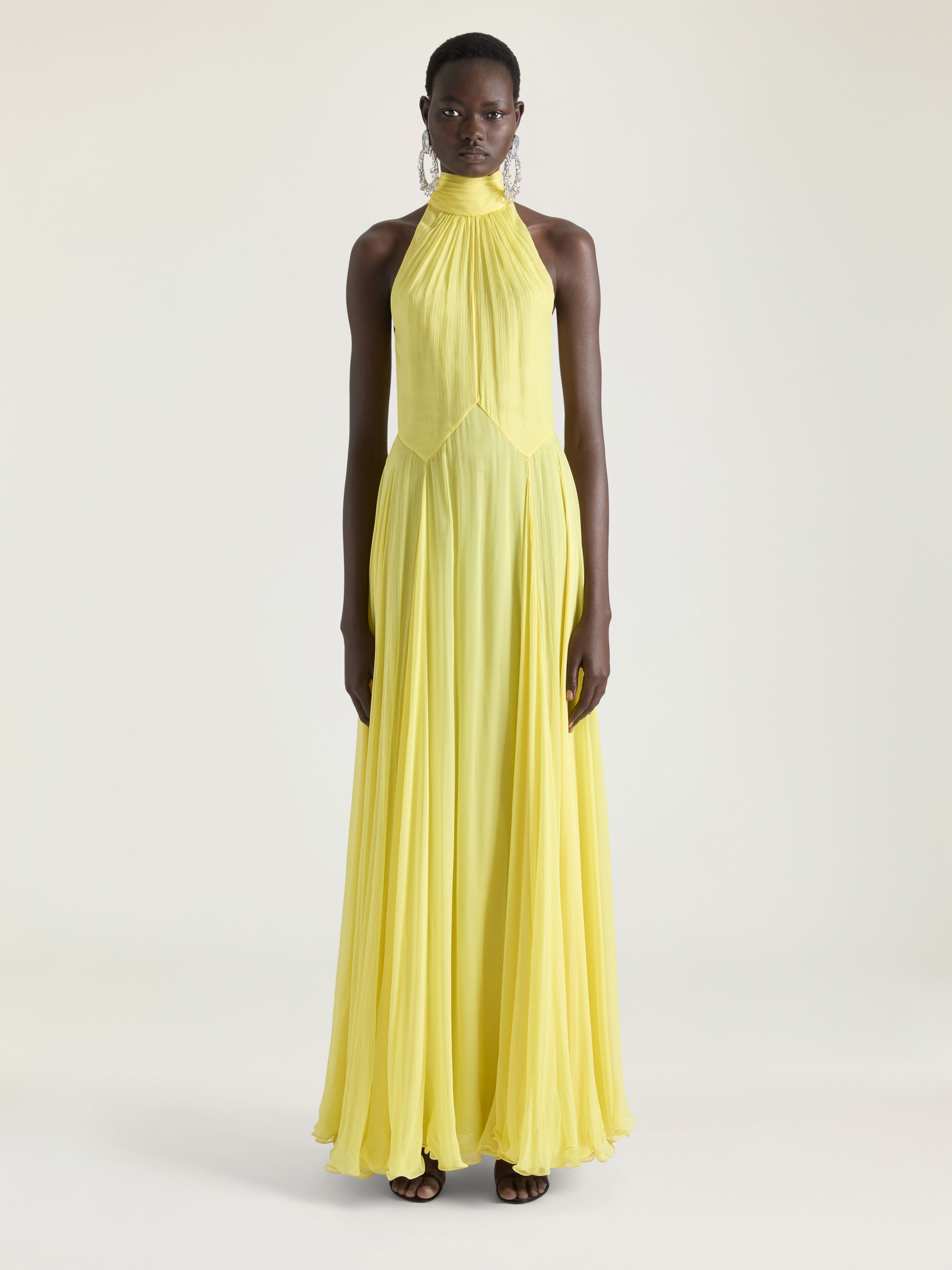 Halterneck evening dress in silk chiffon with bow detail